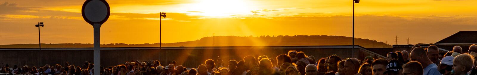 The crowds at Ffos Las basking in a beautiful sunset