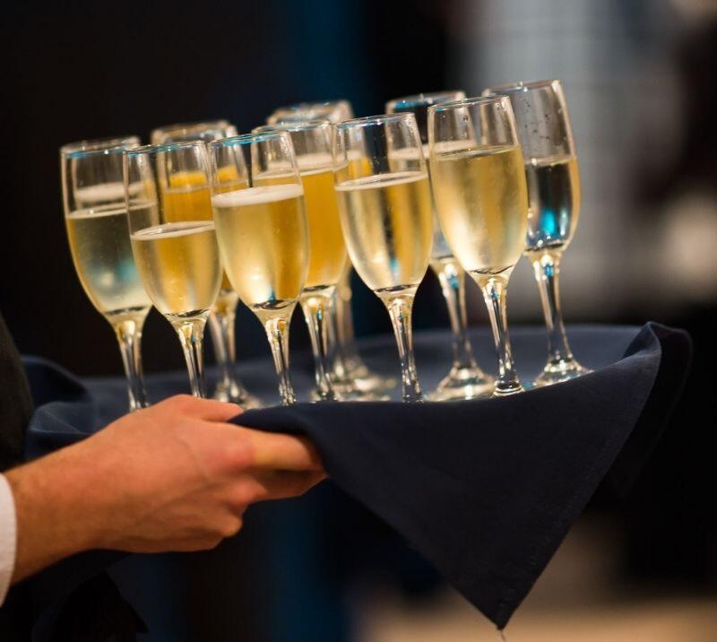 Champagne glasses possed ready for Christmas party guests to drink