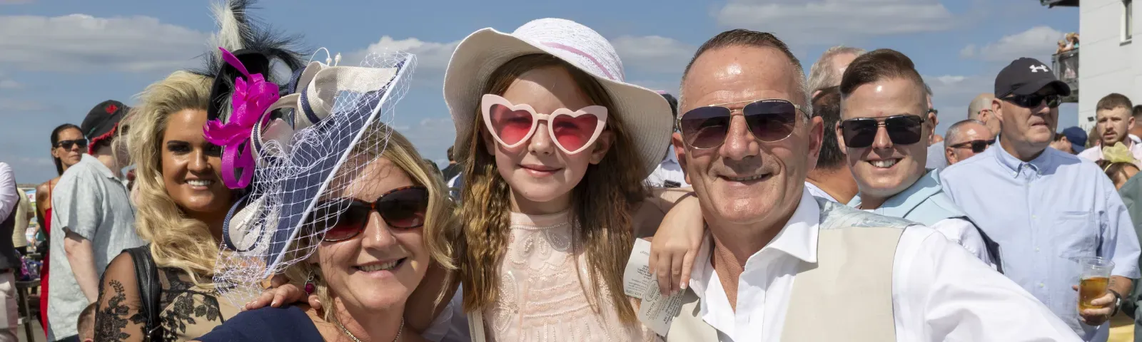 A family pose together at the track side at Ffos Las Racecourse