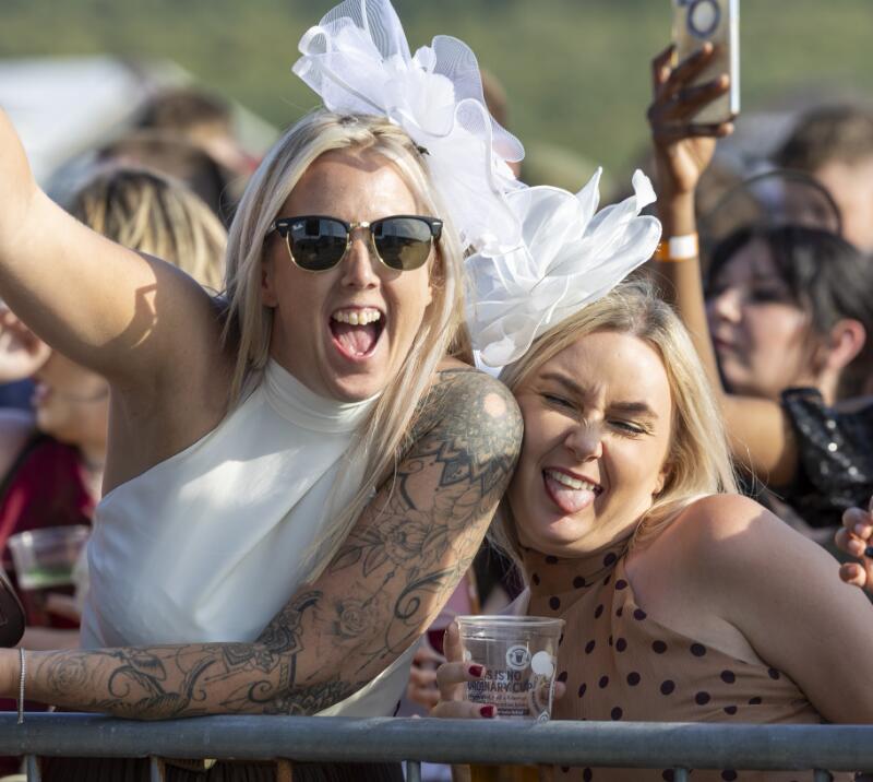 Two friends at Ffos Las races pulling faces for the camera