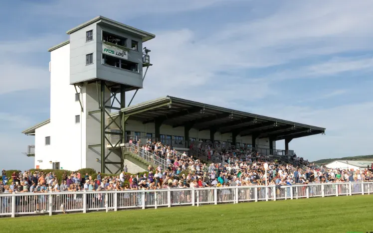 The grandstand at Ffos Las packed with people