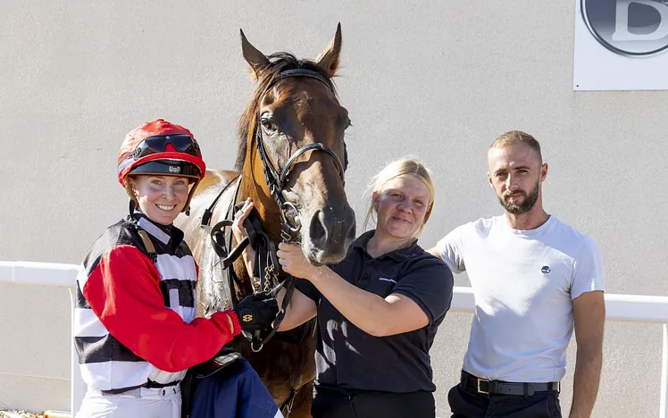 Jockey and trainers with their horse